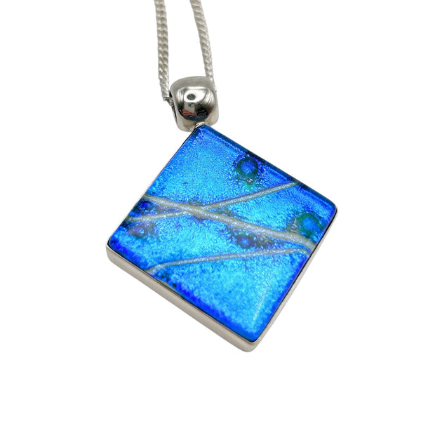 Beautiful pendant in blue and silver dichroic glass.