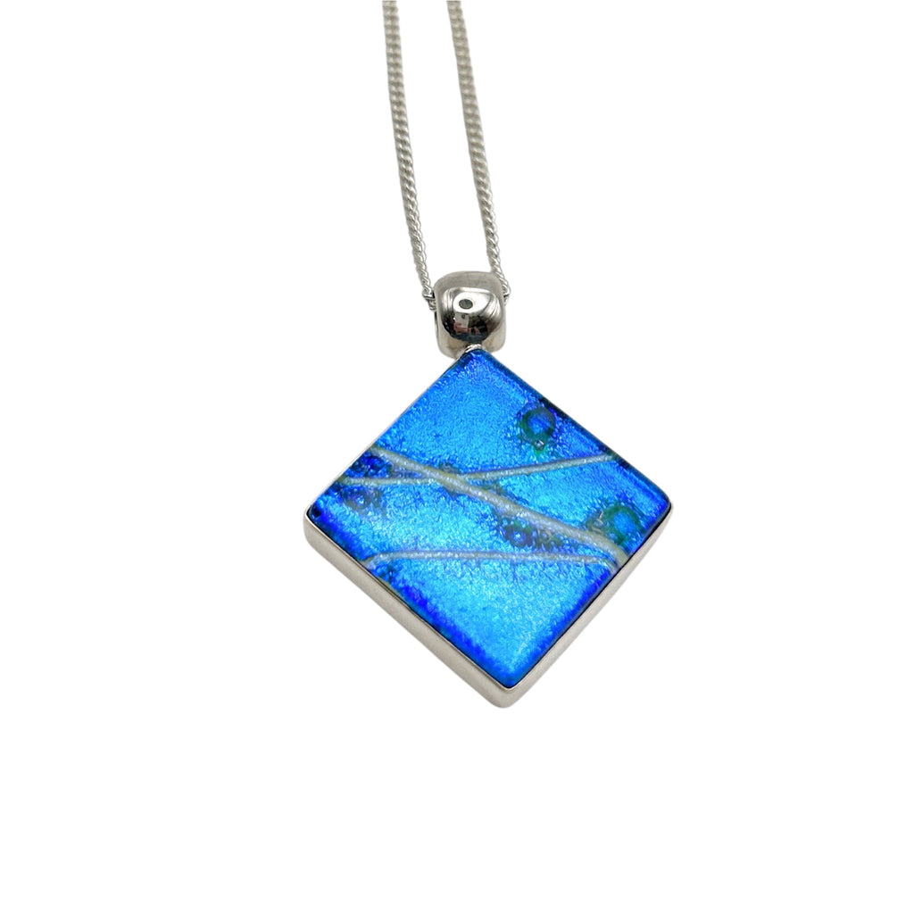 Beautiful pendant in blue and silver dichroic glass.