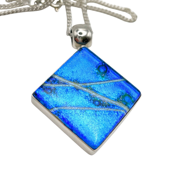 Beautiful pendant in blue and silver dichroic glass.