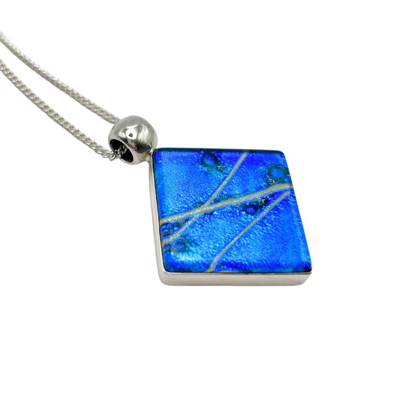 Beautiful pendant in blue and silver dichroic glass.