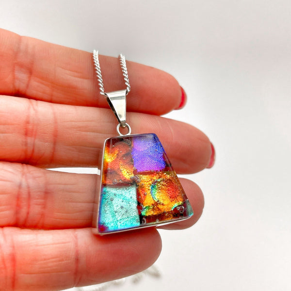 Beautiful orange and purple dichroic glass pendant